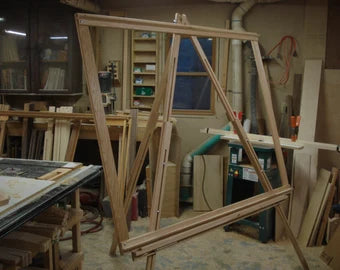 large vertical wooden weaving loom manufactured with materials locally sourced from Eden, NY. Heddle Bar.