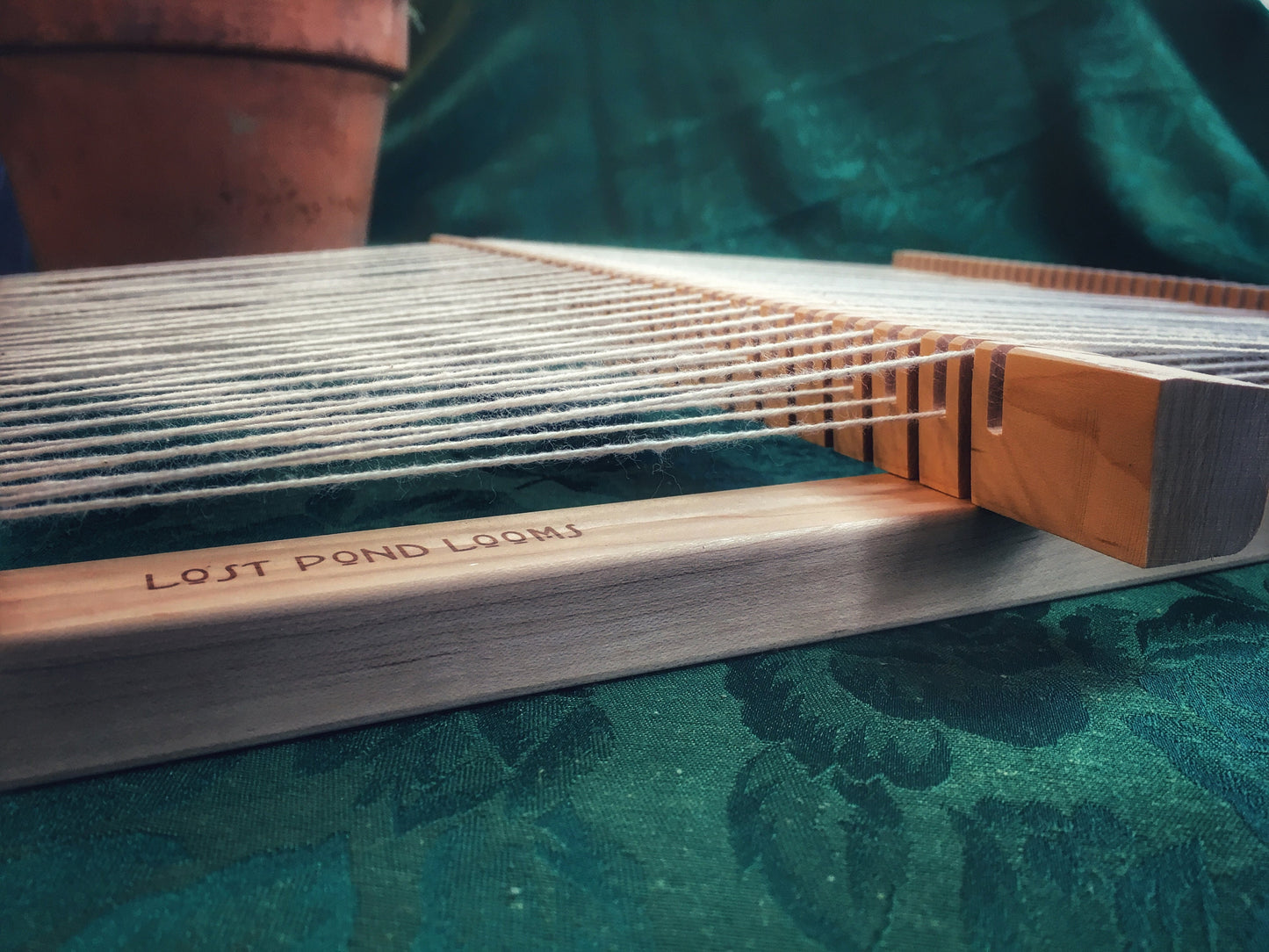 Rotating Heddle Bar for Wooden Weaving Loom with Yarn. On Dragonfly and Bullfrog. Lost Pond Looms by Eden Bullrushes Inc.