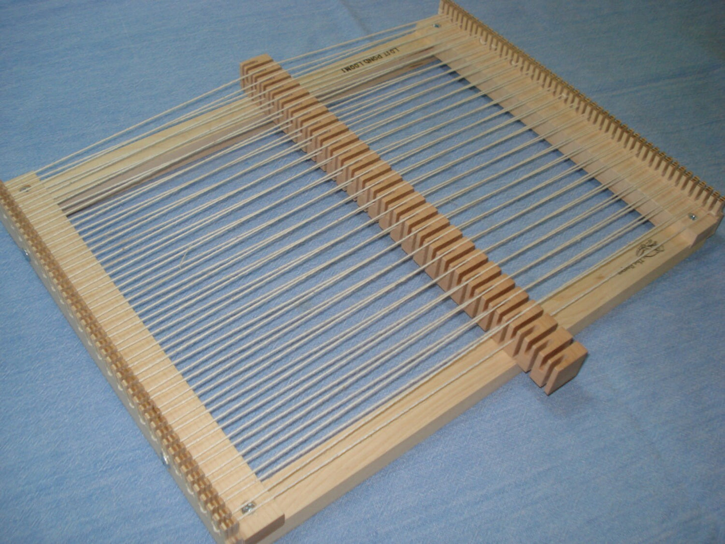 Full Size Rotating Heddle Bar for Wooden Weaving Loom with Yarn. On Dragonfly and Bullfrog Table Top Looms. Lost Pond Looms by Eden Bullrushes Inc.